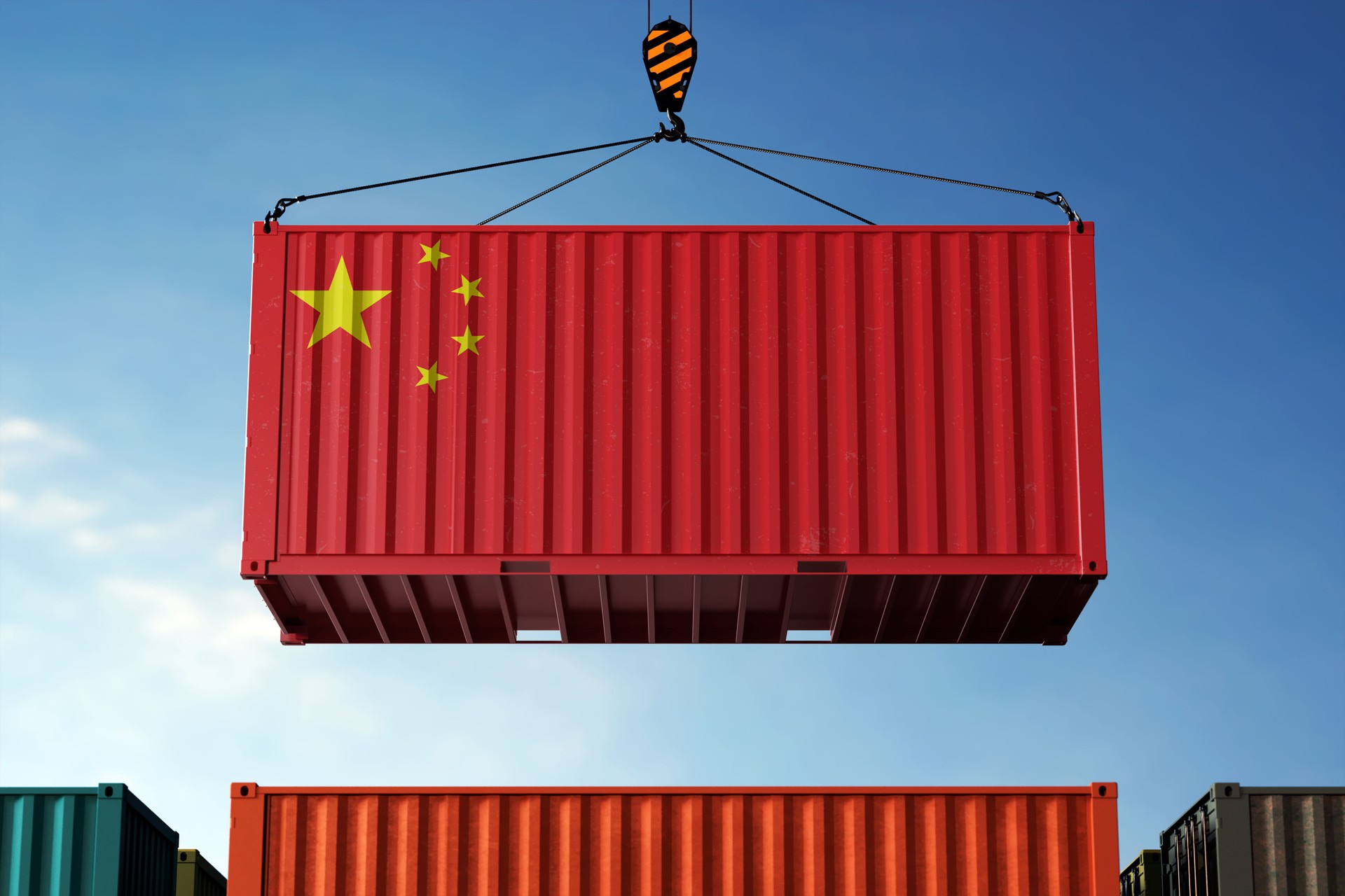 China trade cargo container hanging against clouds background
